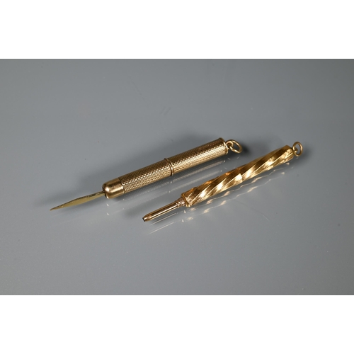 234 - A 9ct yellow gold toothpick with engine turned decoration and an unmarked yellow metal retractable p... 