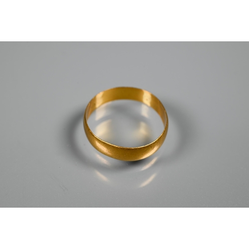 243 - A 22ct wedding band, 2.1g, size OMisshapen