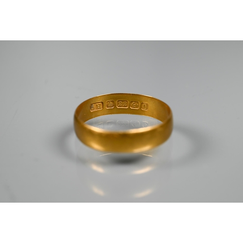 243 - A 22ct wedding band, 2.1g, size OMisshapen