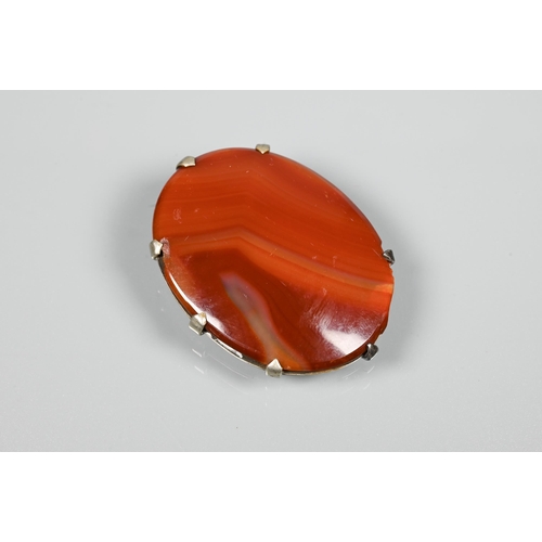 252 - An oval agate brooch, white metal mounted stamped E Bott; a cornelian-set signet ring; agate set rin... 