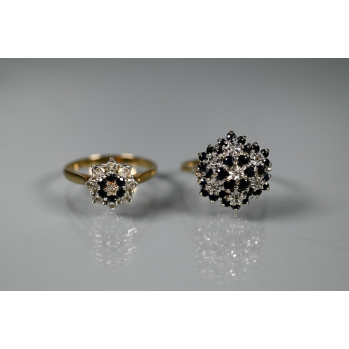 257 - Two 9ct yellow gold cluster rings set with dark sapphires and diamonds, size U and V (2)