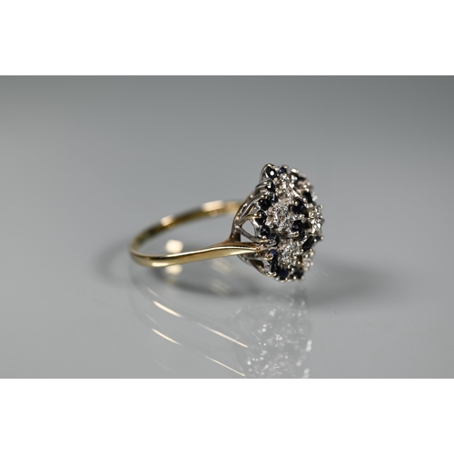 257 - Two 9ct yellow gold cluster rings set with dark sapphires and diamonds, size U and V (2)