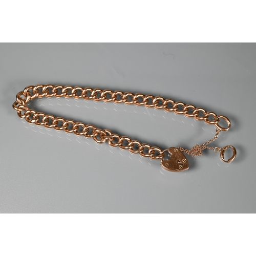 263 - A 9ct rose gold curb bracelet with padlock and safety chain attached, approx 10.5g