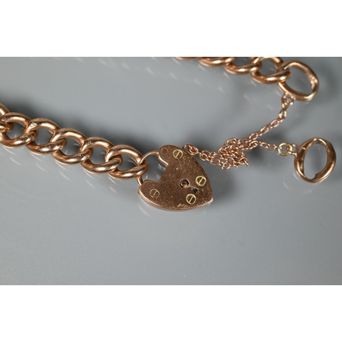 263 - A 9ct rose gold curb bracelet with padlock and safety chain attached, approx 10.5g