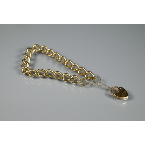 264 - A 9ct yellow gold curb bracelet, with padlock and safety chain attached, approx 32.7g