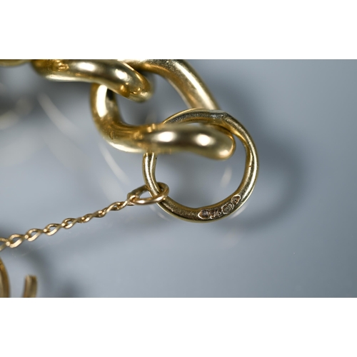 264 - A 9ct yellow gold curb bracelet, with padlock and safety chain attached, approx 32.7g