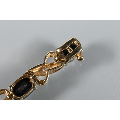 267 - A bracelet set with oval sapphires and diamonds, yellow metal stamped 375; a 9ct yellow gold snake l... 