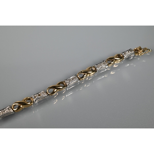 268 - A diamond set bracelet, concealed clasp, set yellow and white metal stamped 9k to/w a 9ct yellow gol... 