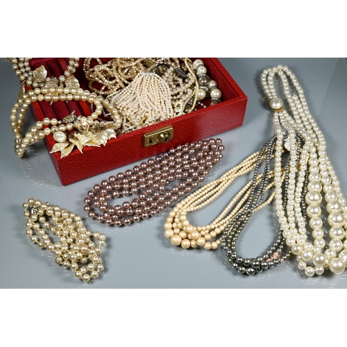 270 - A jewel box including a quantity of various simulated and cultured pearls