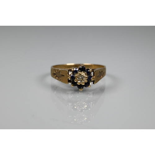 273 - A 9ct yellow gold wedding band (distorted), a 9ct cluster ring set diamond and sapphires, a 9ct cros... 