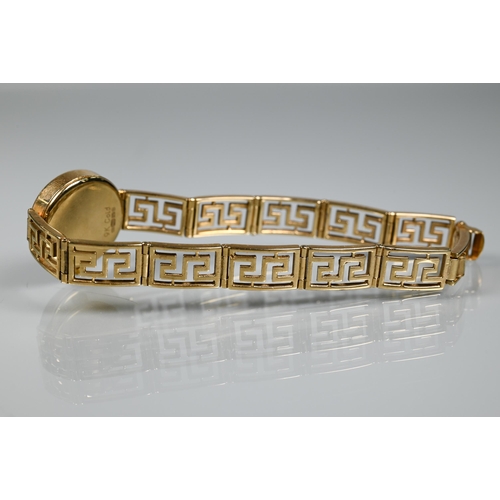 276 - A 9ct gold Rotary watch on Greek key style bracelet strap