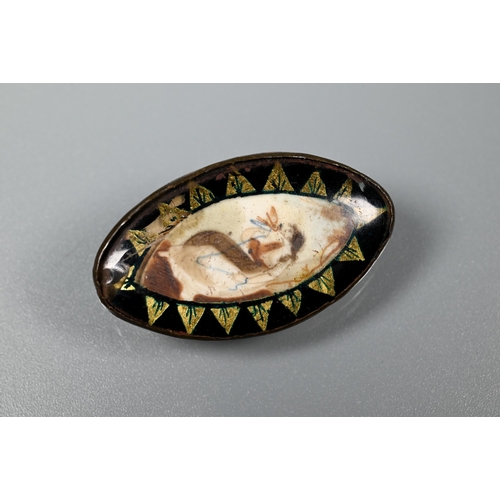 279 - A Victorian oval mourning brooch featuring plaited hairwork to front and back, the oval blue enamel ... 