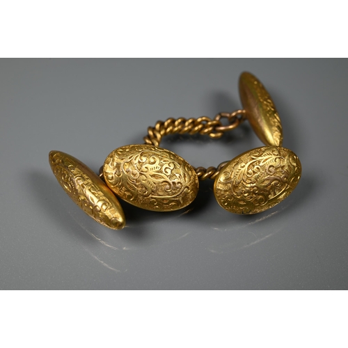 283 - A pair of 15ct yellow gold chased cufflinks, chain-linked with oval front and torpedo back, 6.1g, a ... 