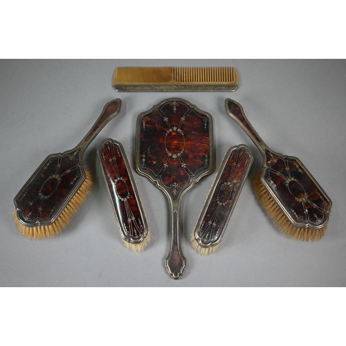 29 - A silver and tortoiseshell with gold piqué-work six-piece brush set including mirror and comb, Willi... 