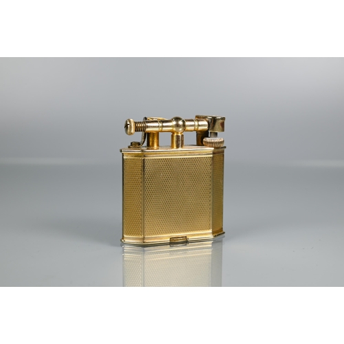 319 - Dunhill - A 9ct yellow gold lighter with engine turned decoration, model no 390107, 4.2 x 3.8cmProv:... 