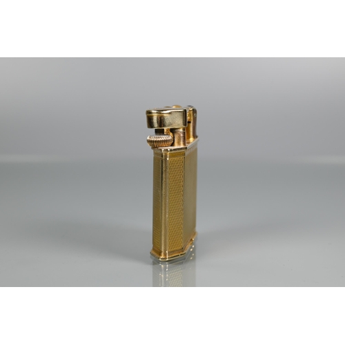 319 - Dunhill - A 9ct yellow gold lighter with engine turned decoration, model no 390107, 4.2 x 3.8cmProv:... 