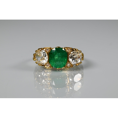 An early 20th century ring with central cushion cut natural emerald with brilliant cut diamond to each side with two rose-cut diamonds between, the emerald approx 1.48 carats, gross weight 5.75g, 18ct yellow gold set, size I