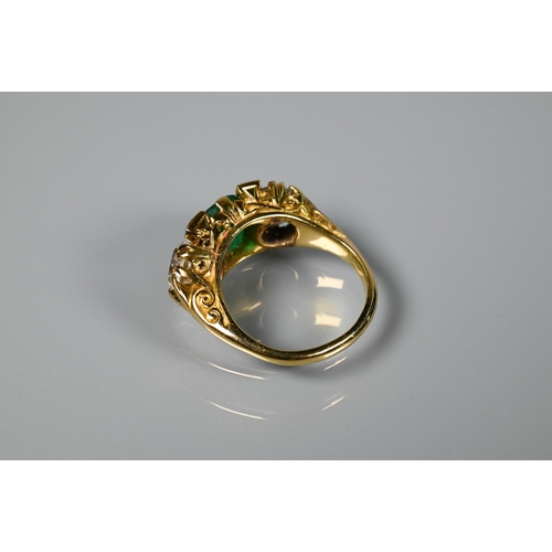 320 - An early 20th century ring with central cushion cut natural emerald with brilliant cut diamond to ea... 