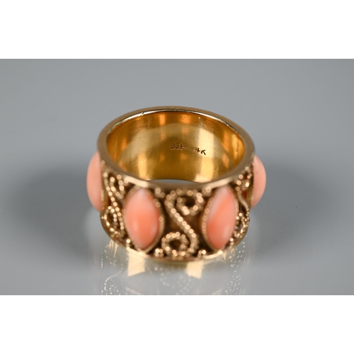 322 - A yellow metal wide band with applied rope twists and set with oval coral cabouchons, stamped 14k, s... 