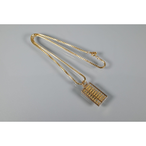 331 - A 9ct yellow gold box link chain with abacus pendant stamped 585 attached, approx 12.4g to/w a pair ... 