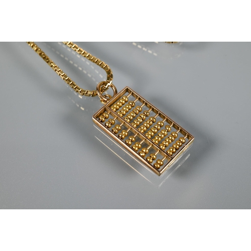 331 - A 9ct yellow gold box link chain with abacus pendant stamped 585 attached, approx 12.4g to/w a pair ... 