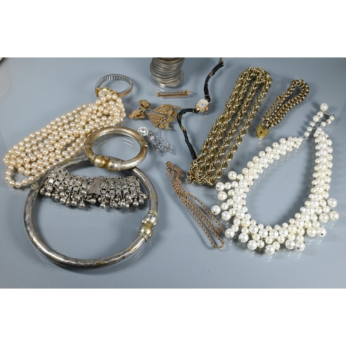 332 - A collection of vintage and other jewellery including gilt metal chains, simulated pearls, two wrist... 