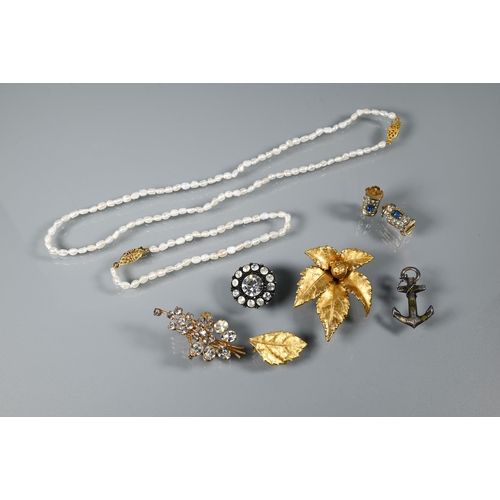 333 - A river pearl necklace and bracelet, a gilt metal brooch in the form of a leaf with single matching ... 