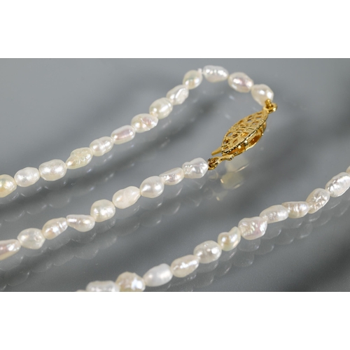 333 - A river pearl necklace and bracelet, a gilt metal brooch in the form of a leaf with single matching ... 