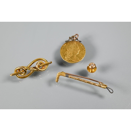 337 - A George III gold guinea dated 1760 (with metal hanger); a Victorian 9ct scroll brooch, a 9ct riding... 