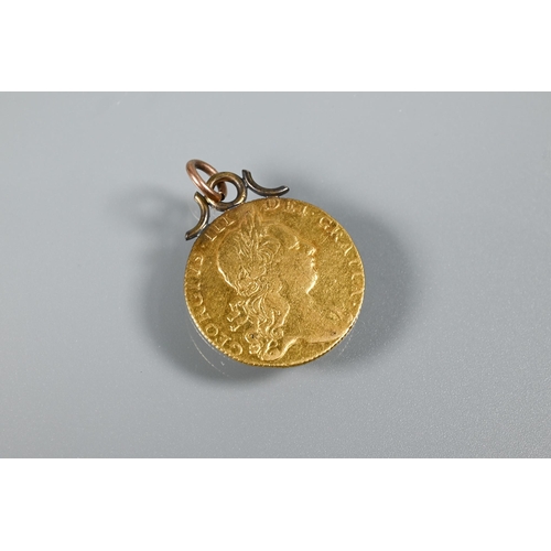 337 - A George III gold guinea dated 1760 (with metal hanger); a Victorian 9ct scroll brooch, a 9ct riding... 