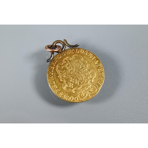 337 - A George III gold guinea dated 1760 (with metal hanger); a Victorian 9ct scroll brooch, a 9ct riding... 