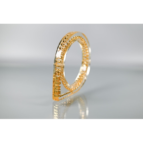 354 - Chanel - A vintage lucite/plexi shaped bangle/bracelet with embedded Chanel motifs - chain and CHANE... 