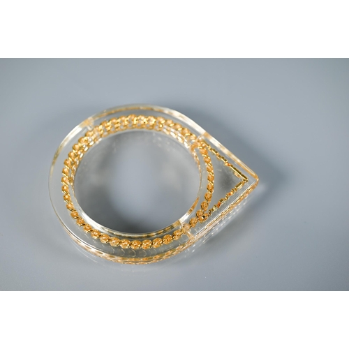 354 - Chanel - A vintage lucite/plexi shaped bangle/bracelet with embedded Chanel motifs - chain and CHANE... 