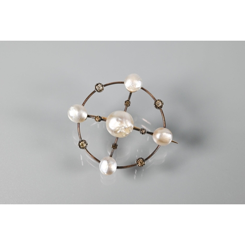 357 - An Edwardian circlet brooch with five pearls on yellow metal knife-edge mount, set with eight rose c... 