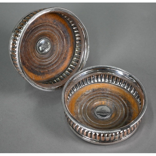 5 - A pair of Old Sheffield Plate wine coasters with gadrooned rims, to/w an electroplated kettle on sta... 
