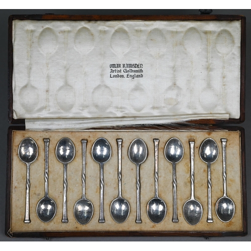 53 - Omar Ramsden:  a cased set of 12 planished silver coffee spoons with seal-tops and twist stems, Lond... 