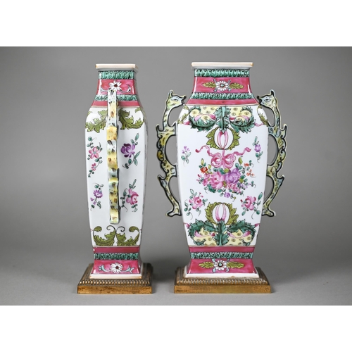 536 - A pair of Samson of Paris 'Chinese Lowestoft' famille rose vases with twin dragon handles, floral de... 