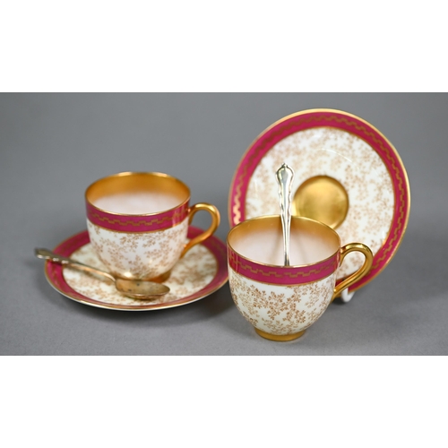 539 - A Royal Worcester set of six coffee cups and saucers with delicate seaweed decoration within gilt an... 