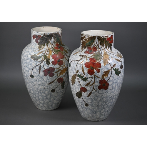 540 - A large pair of 19th century ovoid pottery vases with painted and gilded floral and foliate designs ... 