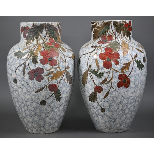 540 - A large pair of 19th century ovoid pottery vases with painted and gilded floral and foliate designs ... 