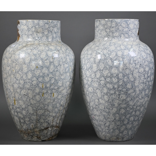 540 - A large pair of 19th century ovoid pottery vases with painted and gilded floral and foliate designs ... 