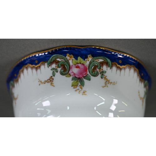 546 - An Edwardian Copeland Spode part dinner/tea service printed with rose vignettes on a blue and gilt r... 