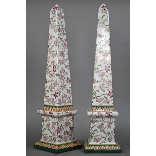 552 - A pair of ceramic obelisks, printed with flowers, 67 cm high (2)