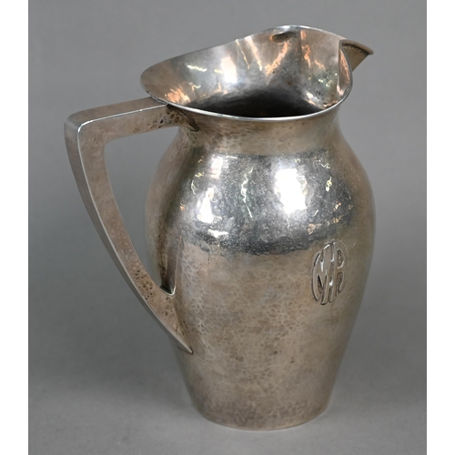 57 - A US Sterling Arts & Crafts '5 Pints' silver jug of planished ovoid form, with applied 'MR' mono... 