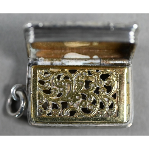 60 - A William IV silver fob vinaigrette with foliate-cast rim, reeded sides and engraved decoration, gil... 