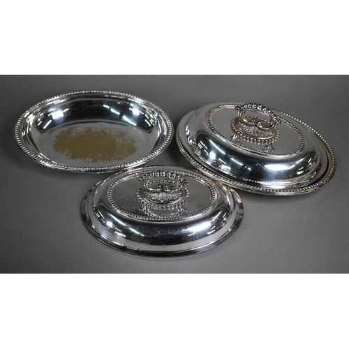 7 - A quantity of electroplated wares including three entrée dishes and covers, a hot-dish, half-fluted ... 
