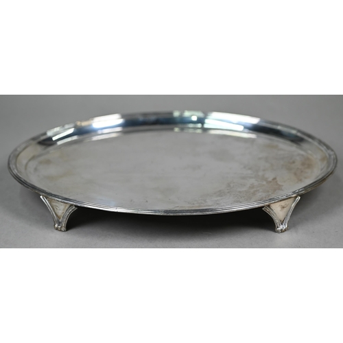 74 - A George III silver salver of elliptical form, with reeded rim and bracket feet, John Hutson, London... 