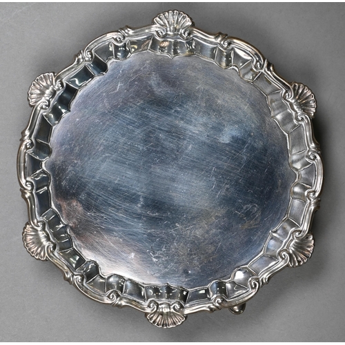 79 - An early George III silver card salver with shell and scroll moulded rim and three hoof feet, Richar... 