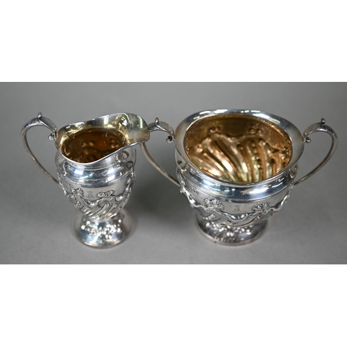 80 - A late Victorian silver four-piece tea service in the Empire manner, with embossed foliate, scroll, ... 