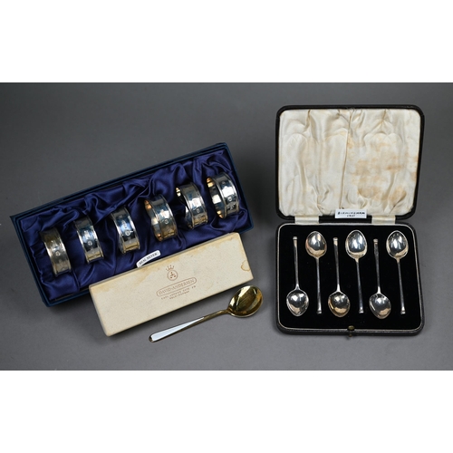85 - A cased set of six silver coffee spoons, Birmingham 1937, to/w a boxed set of six napkin rings, Shef... 